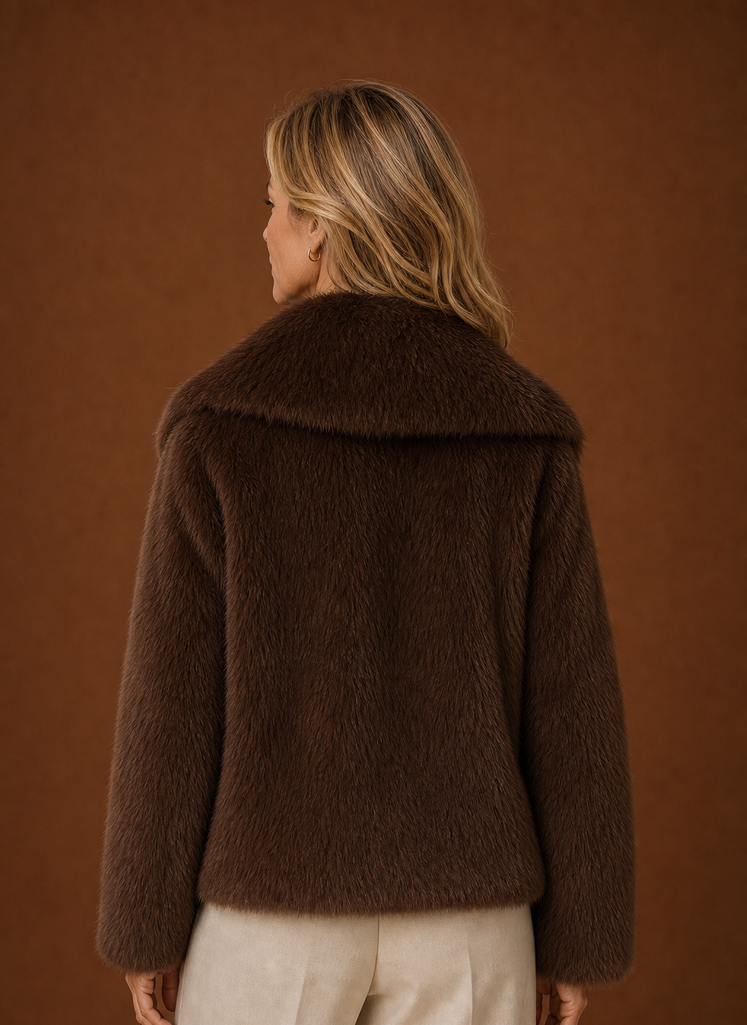 Back view of women's faux fur coat with smooth, clean lines