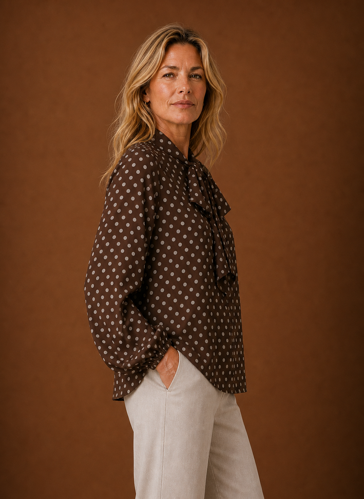 Side view of the blouse highlighting the long sleeve and profile fit
