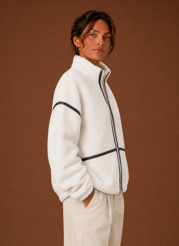 Side view of women's sherpa jacket highlighting collar and relaxed fit