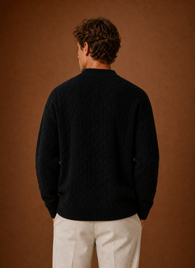Back view of men's cable knit cardigan showing cable knit texture