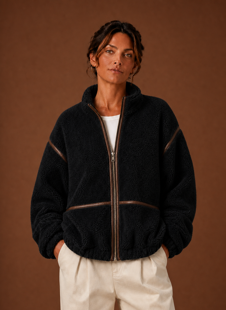 Front view of women's sherpa jacket on mannequin showing zip closure and pockets