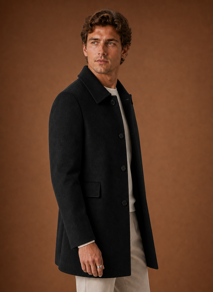 Side profile of men's long overcoat highlighting longline fit