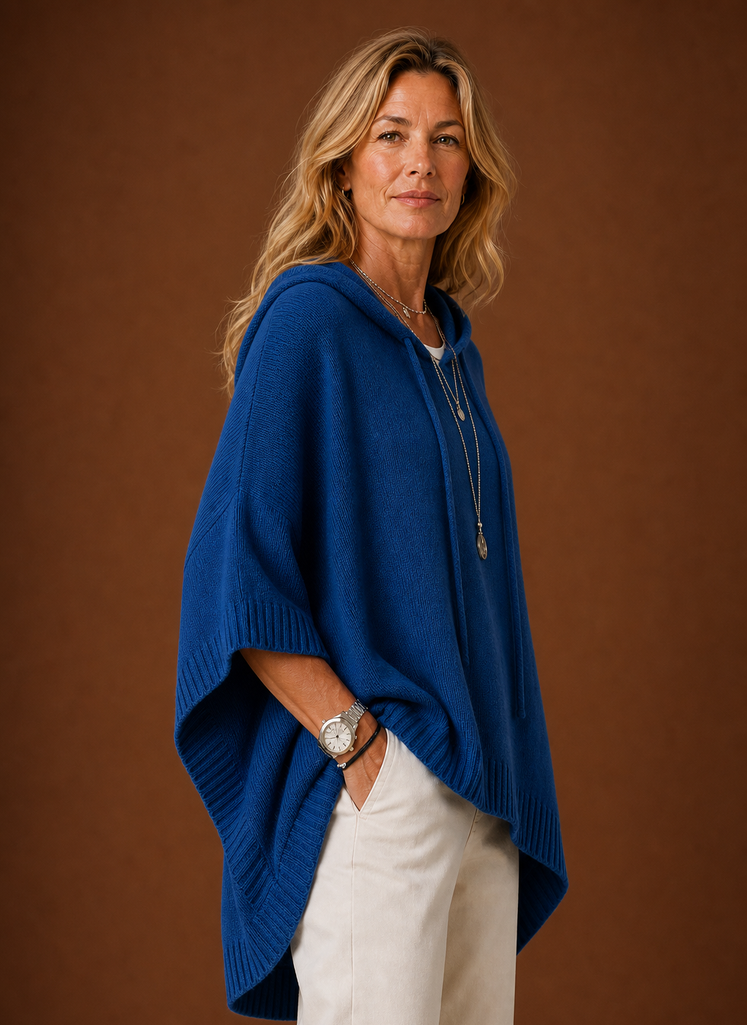 Side profile of hooded pullover highlighting oversized silhouette and sleeve length