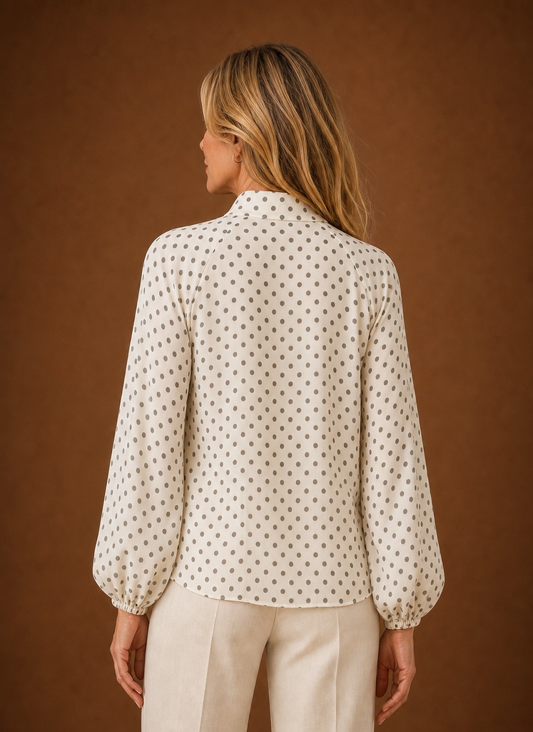 Back view of the blouse showing the high neckline and rear fit