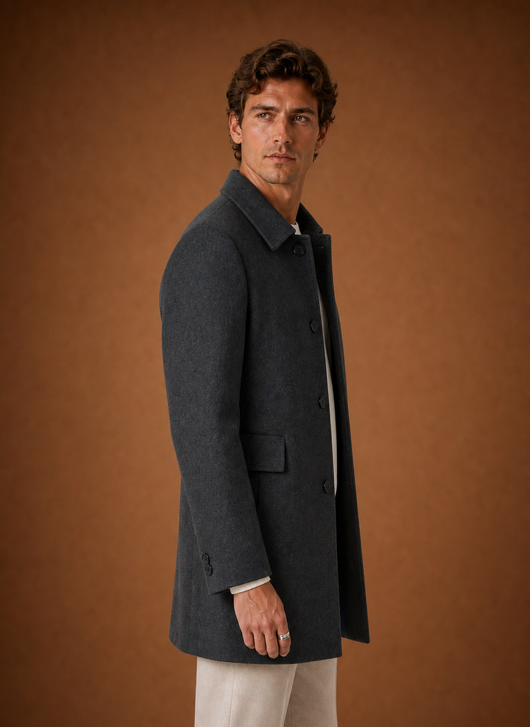 Side profile of men's long overcoat highlighting longline fit