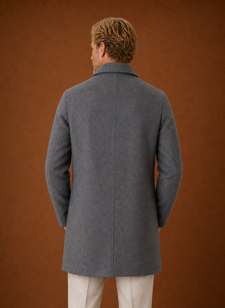Back view of a men's mid-length overcoat highlighting the streamlined construction