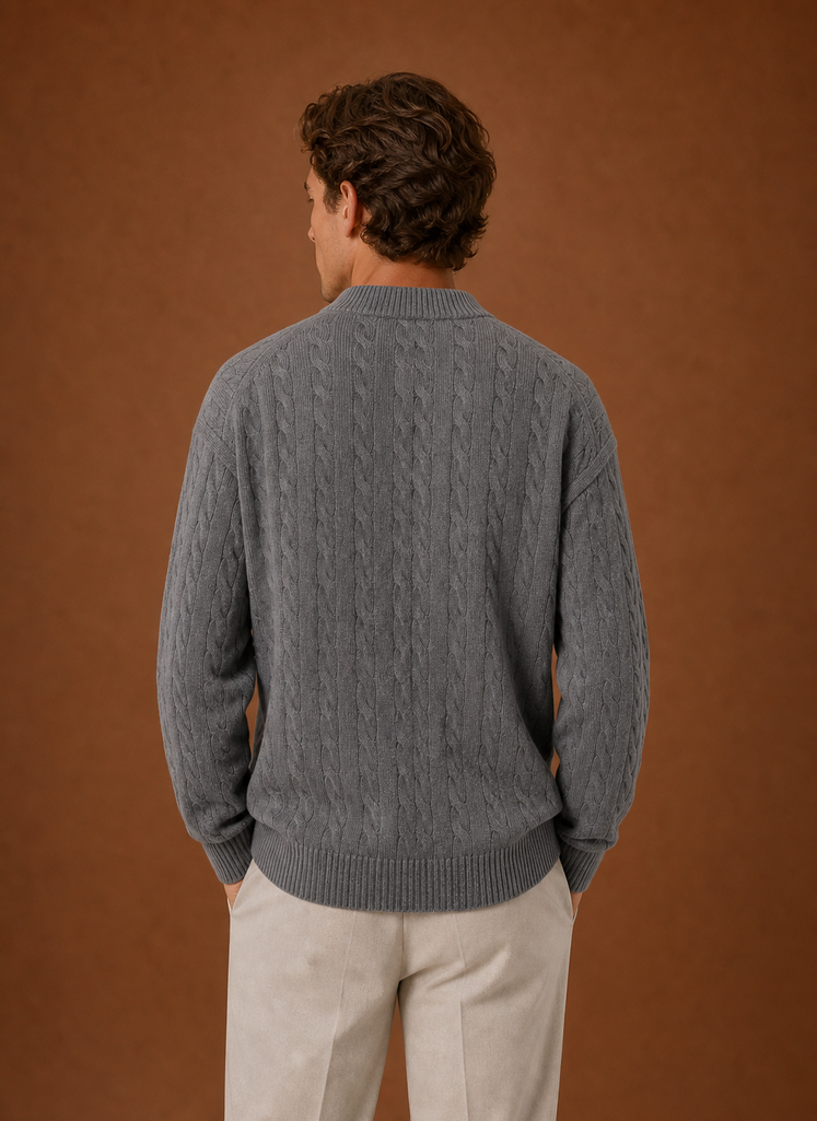 Back view of men's cable knit cardigan showing cable knit texture