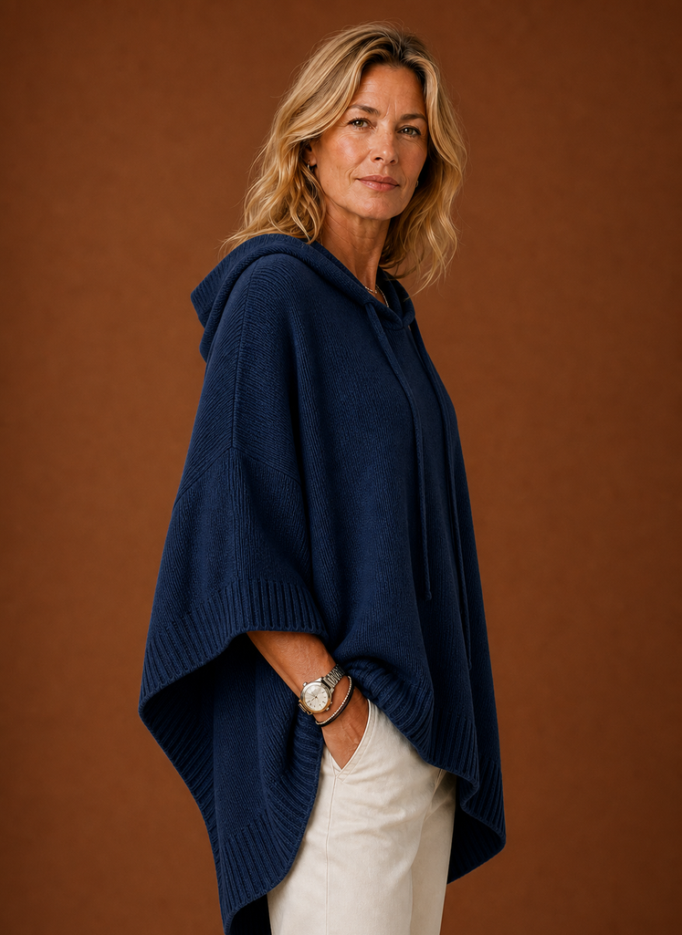 Side profile of hooded pullover highlighting oversized silhouette and sleeve length